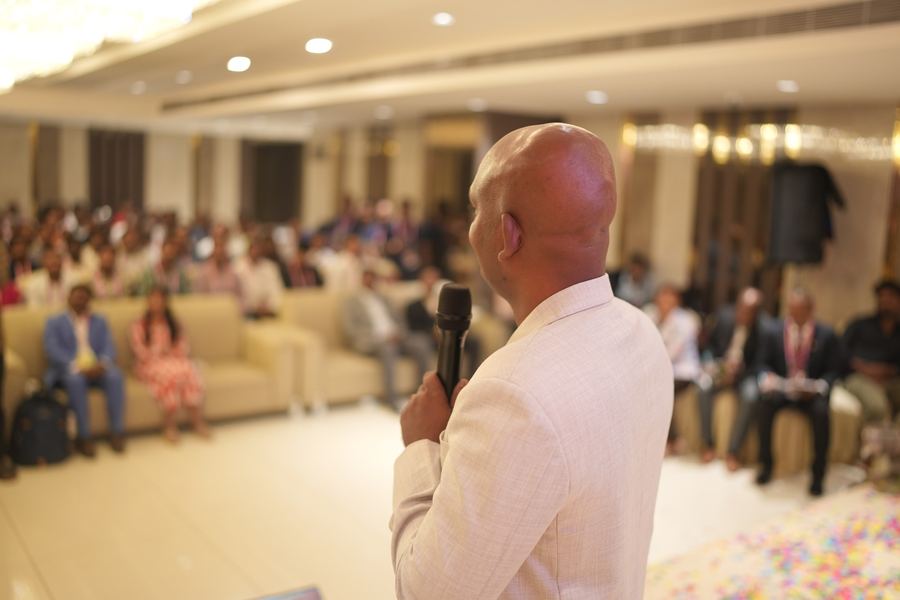 Gangadhar speaking to an audience